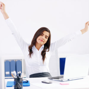 Young woman streaching at office