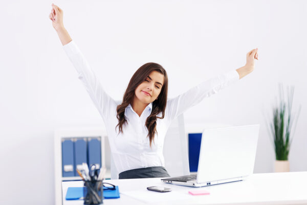 Young woman streaching at office