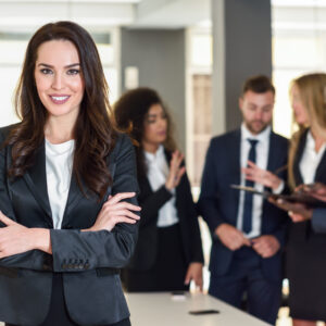 Businesswoman leader in modern office with businesspeople workin